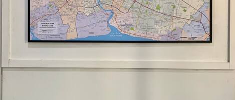 A framed Bangkok map with postal codes.