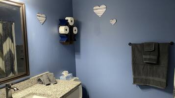 Shower, towels, shampoo, toilet paper