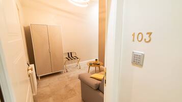 Superior Suite | Living area | 30-inch flat-screen TV with cable channels