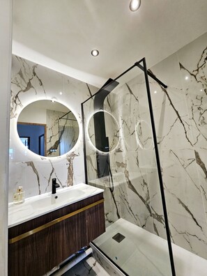 Shower, free toiletries, hair dryer, slippers