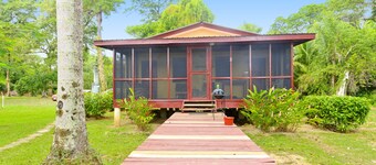 Beautiful cabin nestled in tropical surroundings on the Banks of the Sitee River