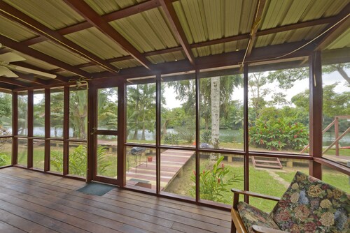 Beautiful cabin nestled in tropical surroundings on the Banks of the Sitee River