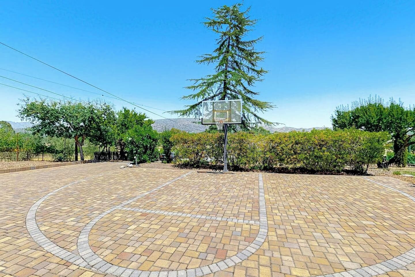 Full basketball court with mountain backdrop & lush garden surrounds.— game on! Perfect for keeping active between wine tastings.