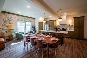 Large dining room table and open kitchen