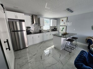 Fridge, microwave, stovetop, coffee/tea maker