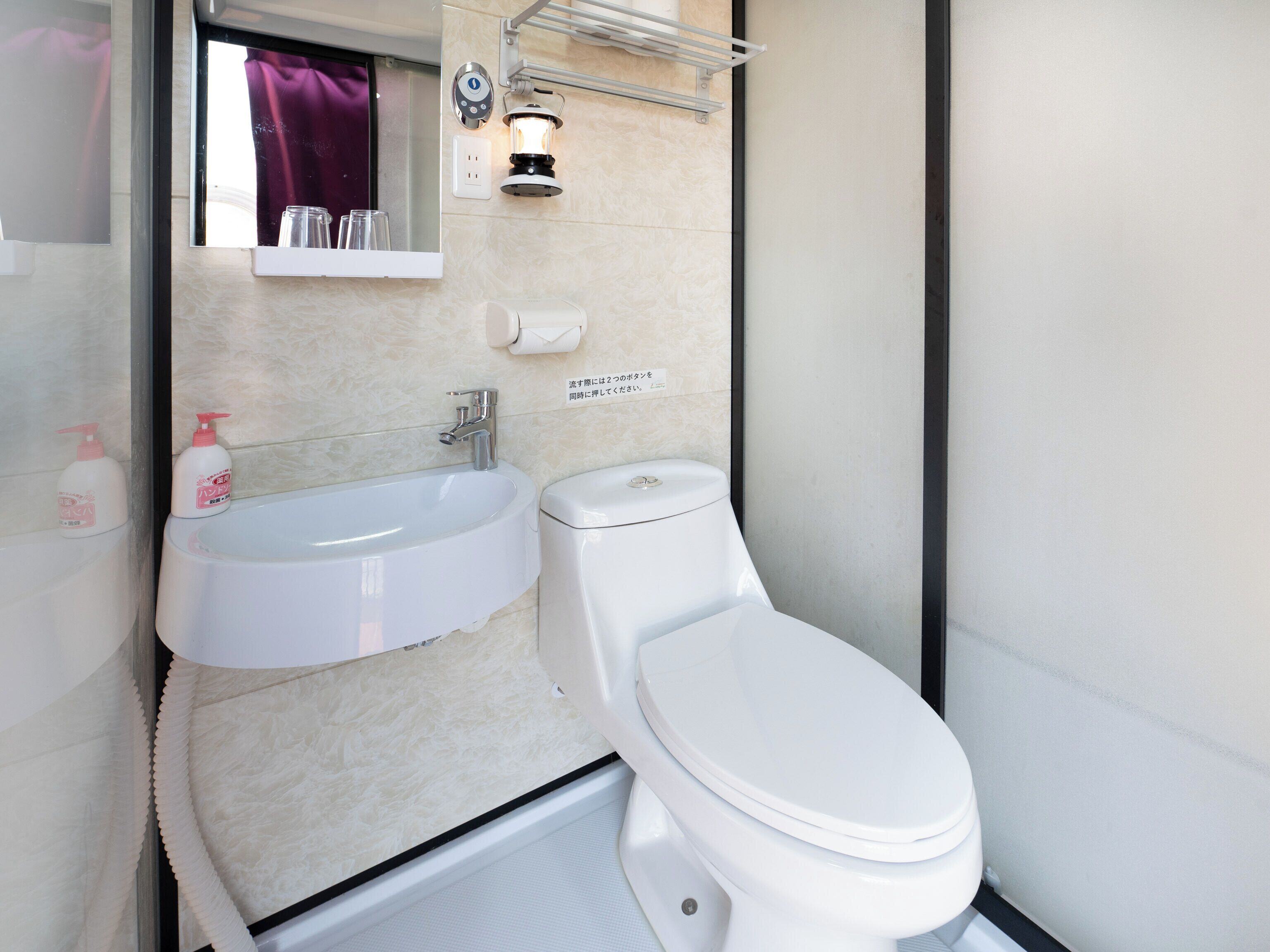 Shower, hair dryer, slippers, towels