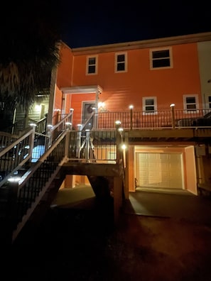 A multi-story building with a staircase and a garage. - Waterfront Paradise*Panoramic Views | Beach access (Pensacola)