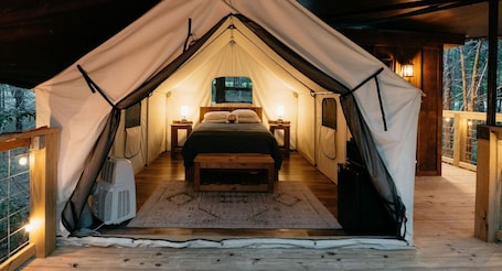 1 bedroom, bed sheets. Treehouse Branson, MO Cozy Glamping Site