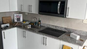Fridge, microwave, stovetop, coffee/tea maker