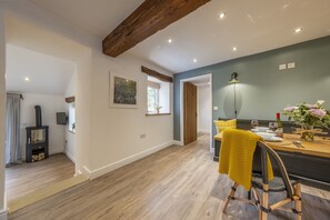 The kitchen and dining area leads through to the cosy sitting room