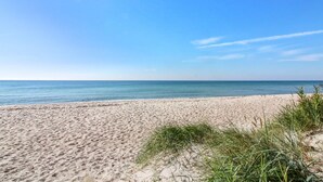 A beach with clear skies and calm waters.