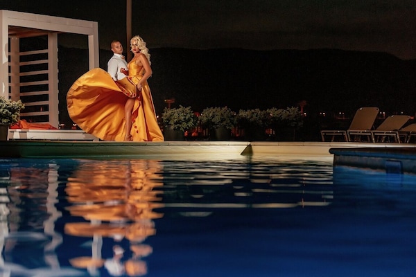 Seasonal outdoor pool, open 10:00 AM to 8:00 PM, pool umbrellas