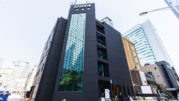 A modern building with a prominent 'CANVAS' sign at the top.