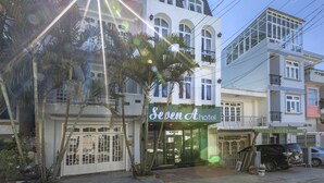 A hotel named 'Seven A Hotel' with a modern facade, large windows, and a visible entrance. - Seven A Hotel (Xuan Huong - Da Lat)