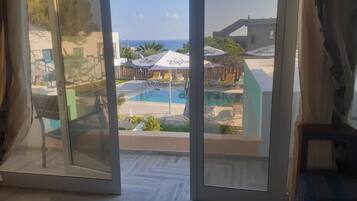 Deluxe Suite, Multiple Bedrooms, Sea View | Terrace/patio