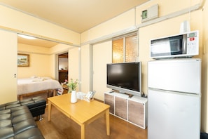 Apartamento básico | Área de estar | TV LCD 37 polegadas com canais digitais