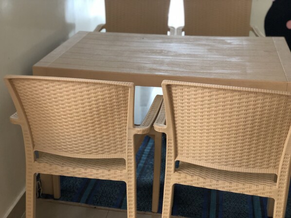 Enjoy meals in this cozy dining area with a rectangular table and two comfortable chairs.