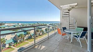 A balcony with a view of the ocean and a spiral staircase. - Destin West Villa PH04 ~ Penthouse w /Hot Tub on Private Rooftop Terrace ~ Beach Views! (Fort Walton Beach)