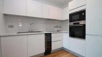 Apartment | Private kitchen | Fridge, microwave, oven, stovetop