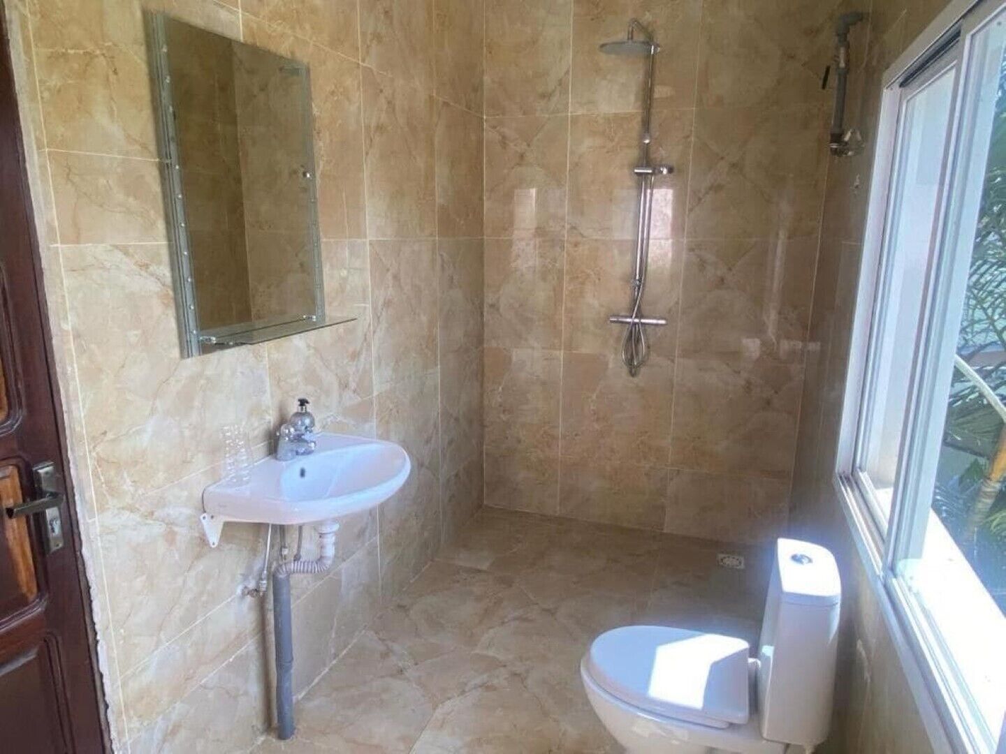 Shower, towels, soap, toilet paper