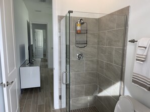 Shower, hair dryer, towels, soap - Stunning new construction 4-bedroom home with a Heated Pool and Spa on a Canal (Cape Coral)
