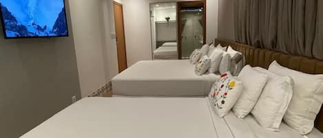 Deluxe Quadruple Room | 1 bedroom, minibar, desk, laptop workspace