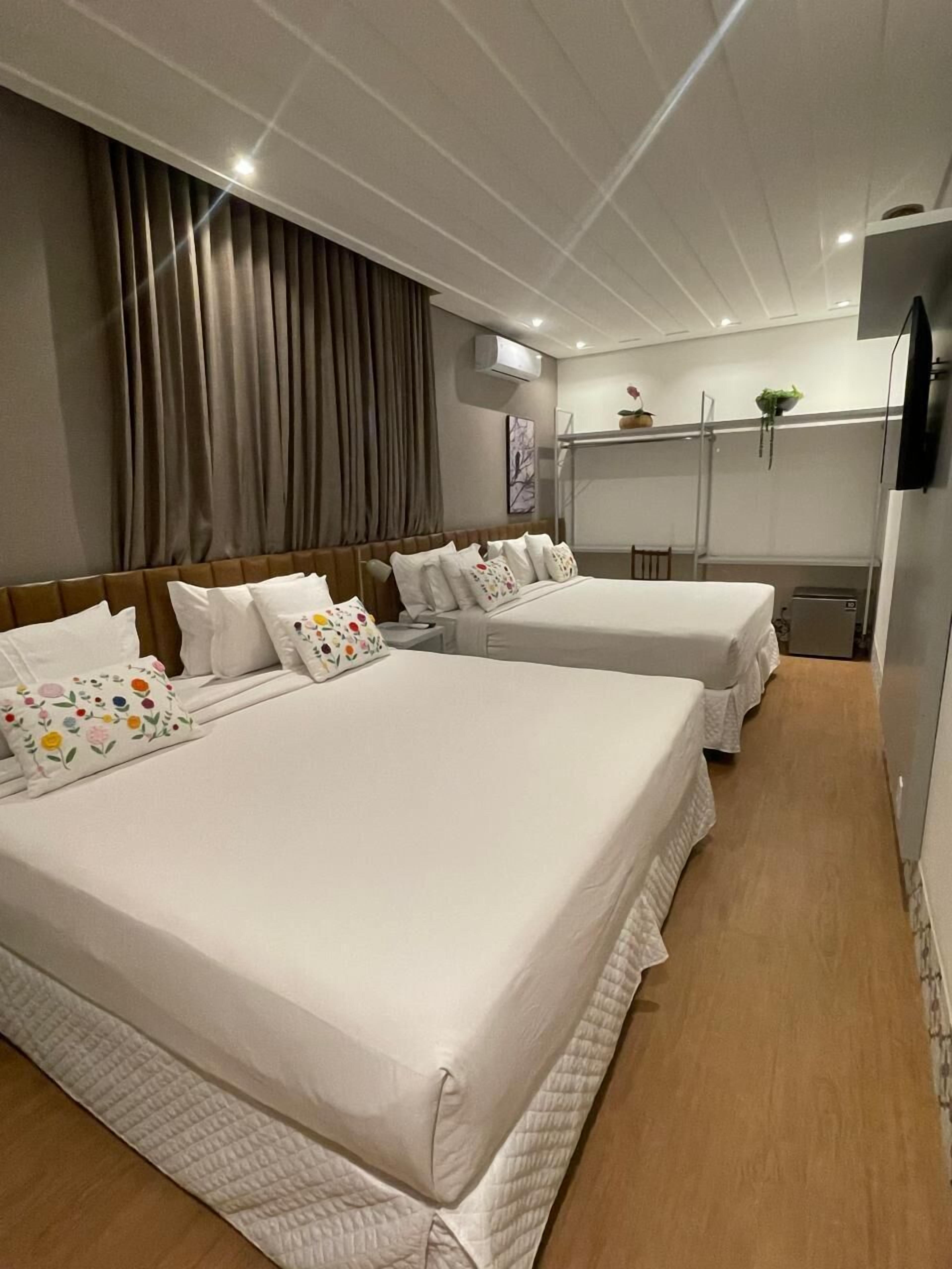 Deluxe Quadruple Room | Minibar, desk, laptop workspace, free WiFi