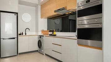 Grand Apartment | Private kitchen | Fridge, microwave, oven, stovetop