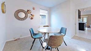 Enjoy meals in this stylish dining area with a round table and four comfortable chairs.