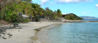 Luxury 3BR old world waterfront estate with a boat and SUV. 