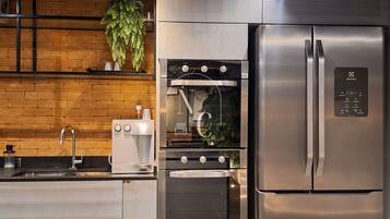 Full-sized fridge, cookware/dishes/utensils, cleaning supplies