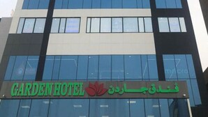 A modern building with a prominent sign for Gardenhotel. - Garden Hotel (Jabriya)