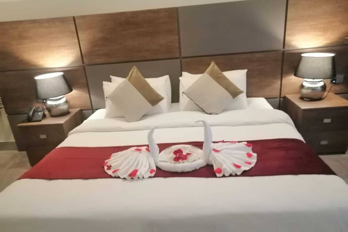 Deluxe-Zimmer | Wohnbereich | Flachbildfernseher