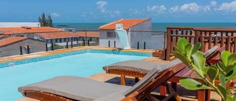 Outdoor pool, open 9:00 AM to 9:00 PM, pool umbrellas, sun loungers