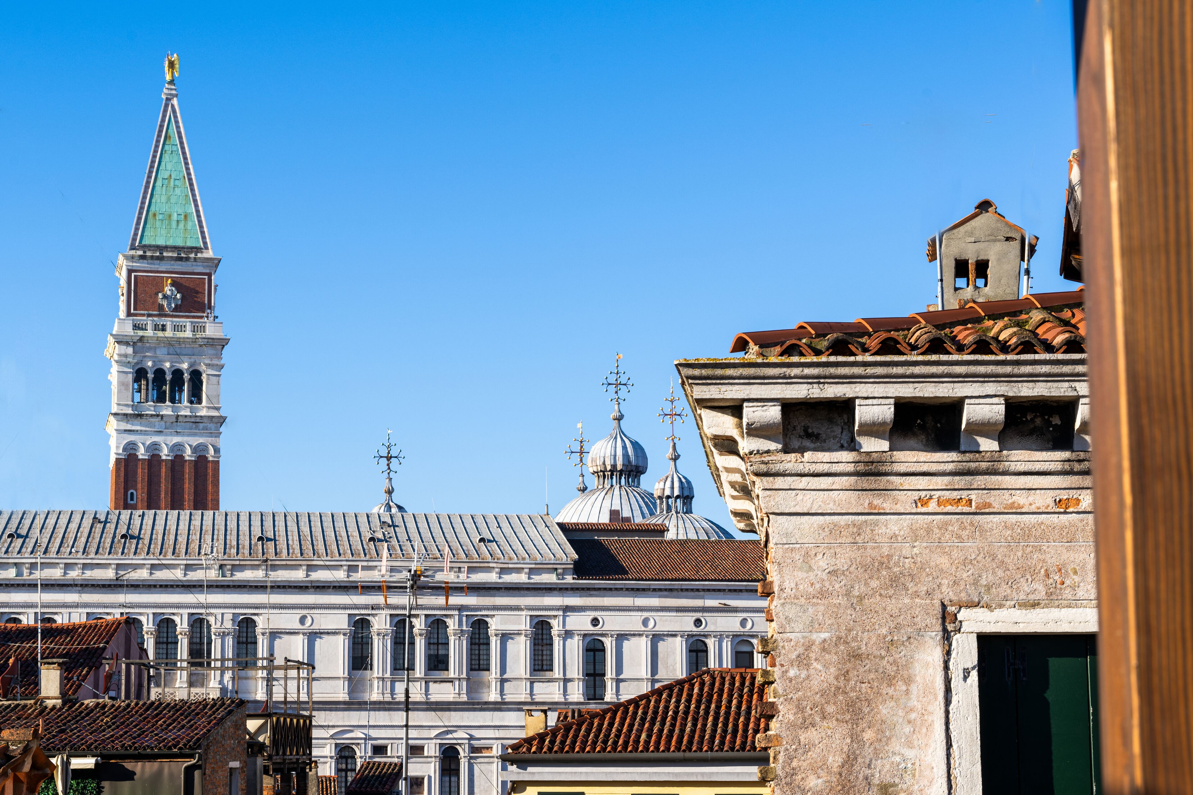 A historic building with a prominent clock tower and domed architecture.