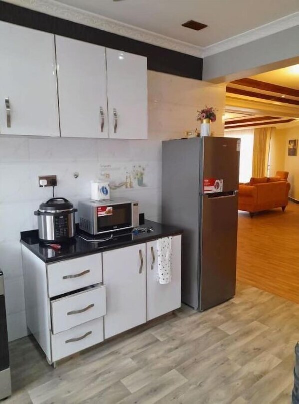Enjoy cooking in the fully equipped kitchen with a refrigerator, microwave, and slow cooker.
