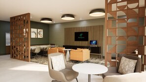Un hall d’hôtel moderne doté d’un espace salon, d’un téléviseur et d’une cloison décorative en bois.