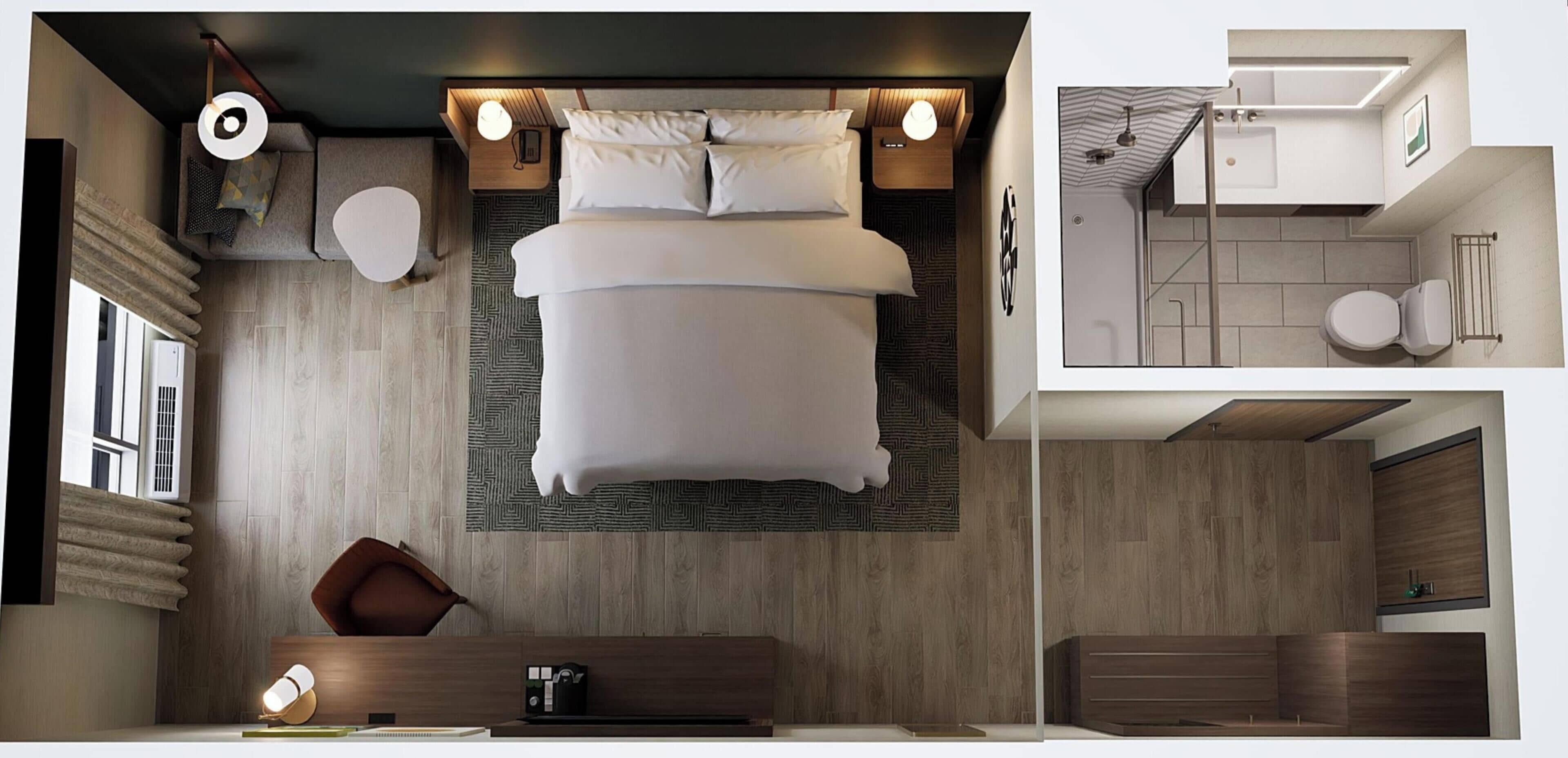Una habitación de hotel moderna con una cama grande, un escritorio y un baño con ducha e inodoro.