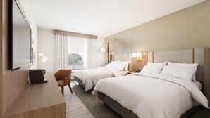 Ein Hotelzimmer mit zwei Betten, einem Schreibtisch, einem Stuhl und einem Fernseher.