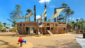 A pirate-themed play structure with slides and climbing areas. - Pet-Friendly Coligny Villa- Minutes to Beach & Celebration Park! (Hilton Head Island)