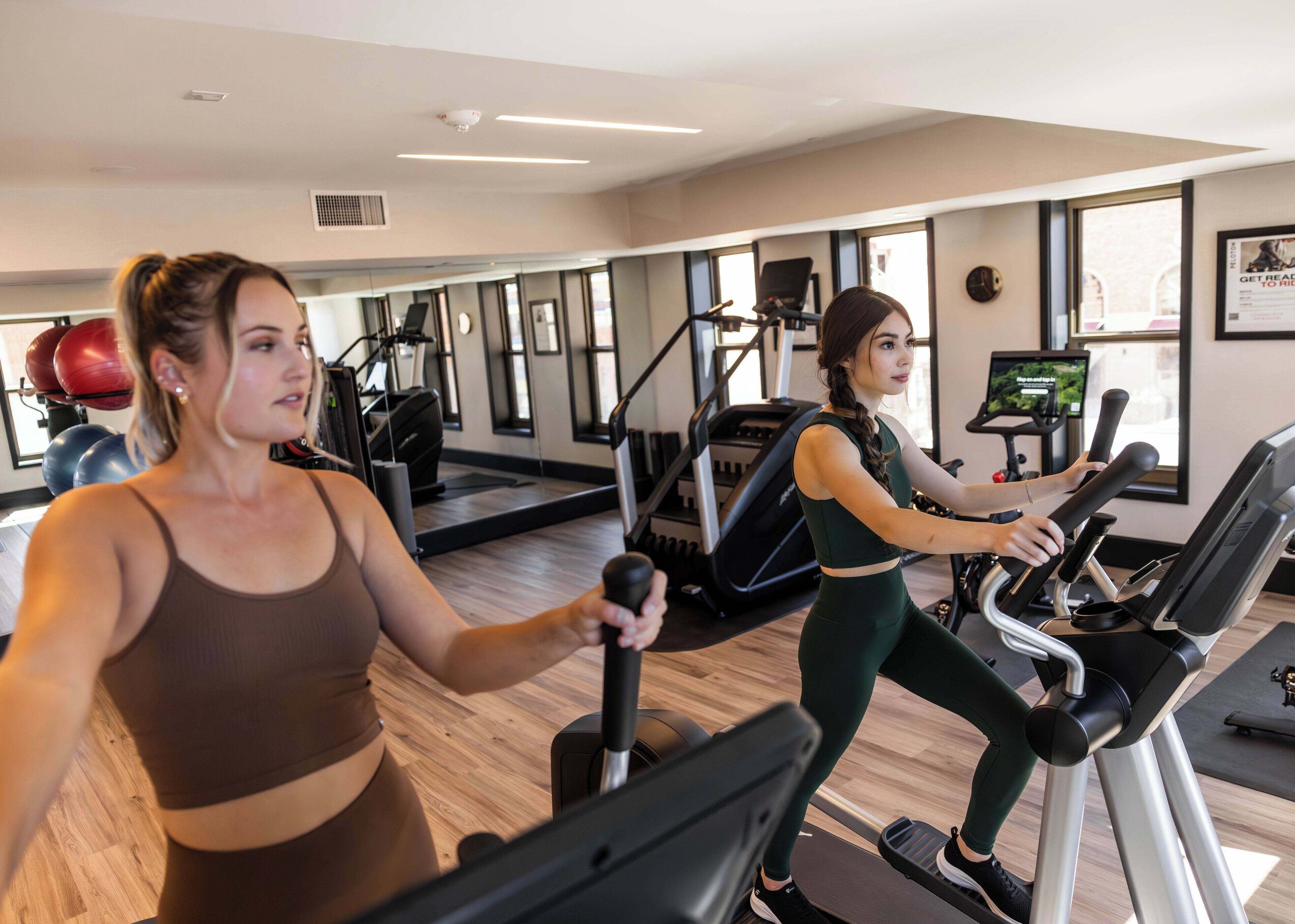 A gym with treadmills and exercise balls.