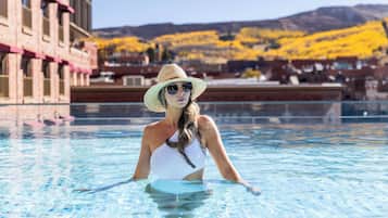 Outdoor pool, open 7:00 AM to 10:00 PM, pool loungers