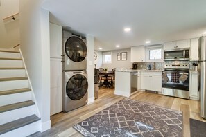 Enjoy cooking in this well-equipped kitchen with a central island, oven, and ample counter space.