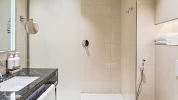 Shower, hair dryer, slippers, towels