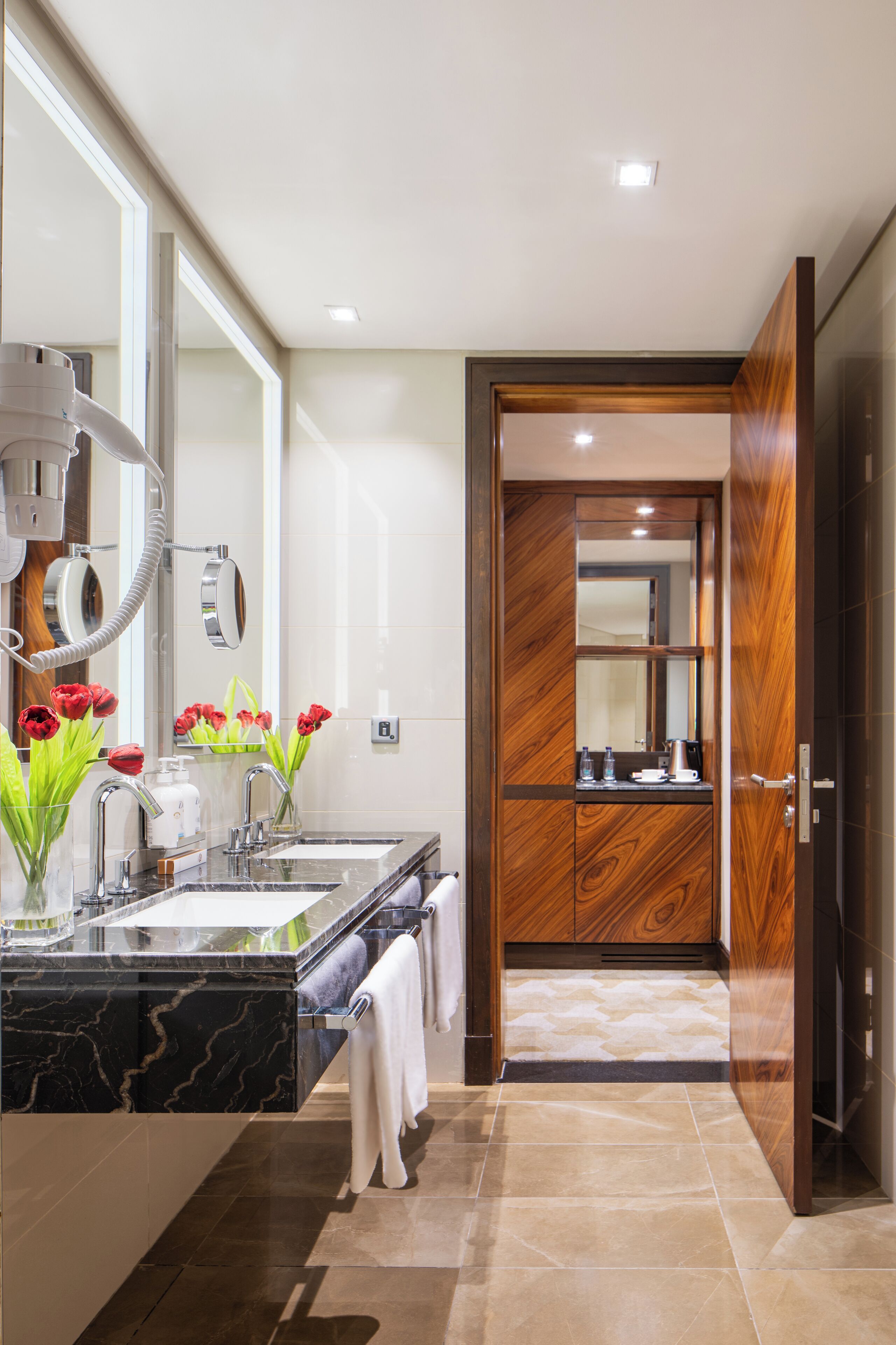 shower, hair dryer, slippers, towels