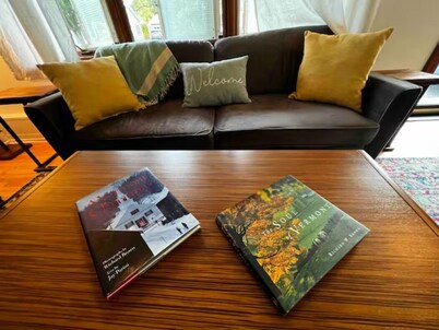 Step into a world where midcentury modern charm embraces Vermont's beauty! 