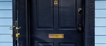 Step into a world where midcentury modern charm embraces Vermont's beauty! 