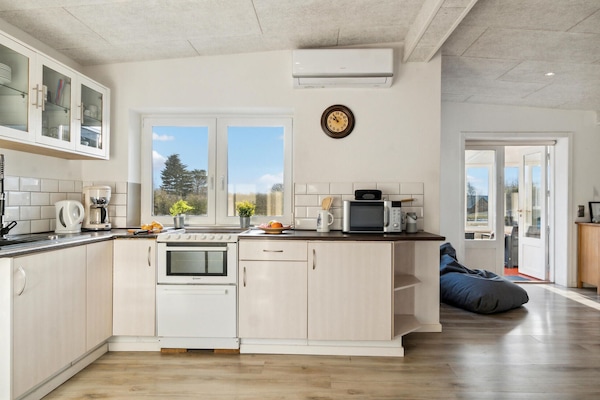 Fridge, stovetop, dishwasher, coffee/tea maker