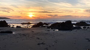 A beach with rocks and the ocean. - Quick walk to the Beach
3 Bedrooms 1.5 Bath
 Sleeps 6 (Dillon Beach)