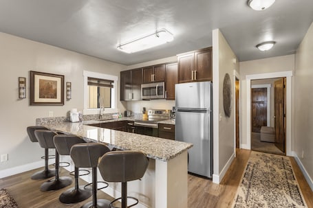 Apartment | Private kitchen | Full-size fridge, microwave, oven, stovetop